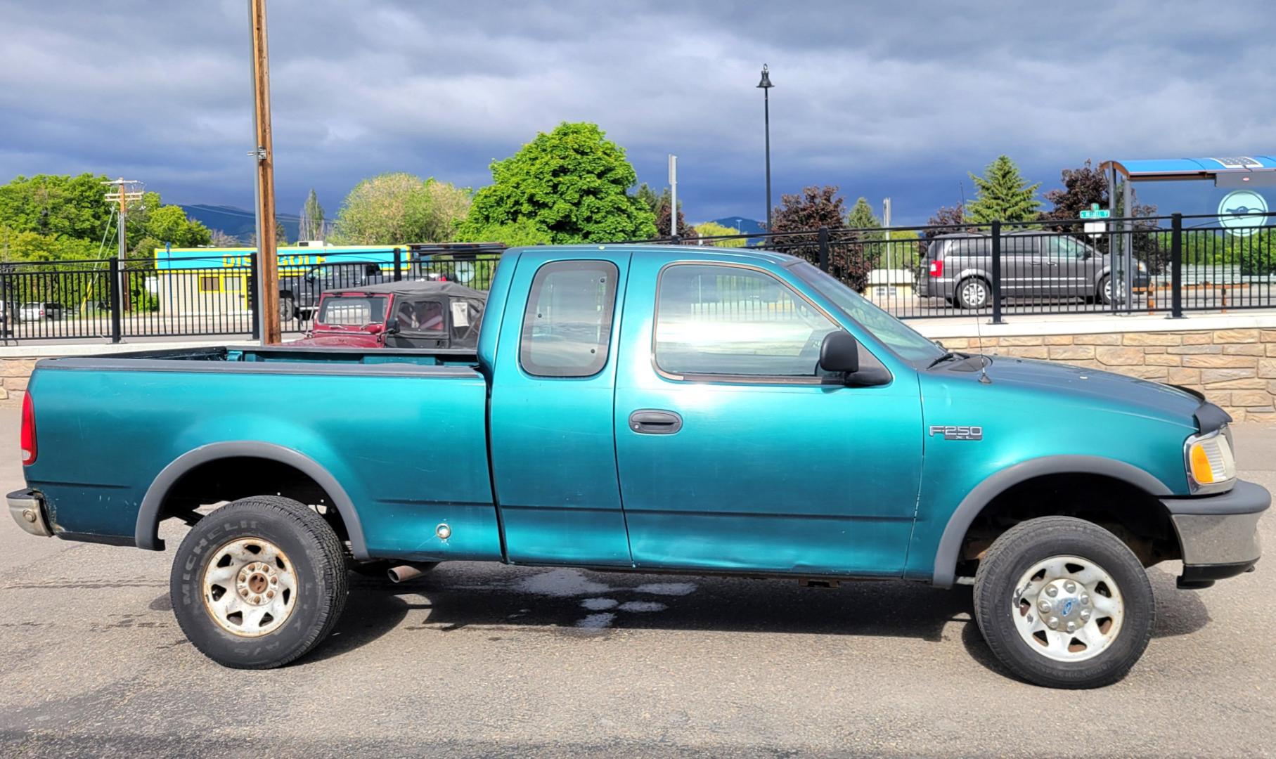 1997 Green /Tan Ford F-250 (1FTFX2866VK) with an 4.6L V8 engine, 4 Speed Manual with Overdrive transmission, located at 450 N Russell, Missoula, MT, 59801, (406) 543-6600, 46.874496, -114.017433 - 4.6L V8 Engine. 4 Speed with Overdrive Manual Transmission. 4 Wheel Drive. 3 Door. Short Box. Air Conditioning. Cruise Control. Financing is NOT Available. - Photo#4